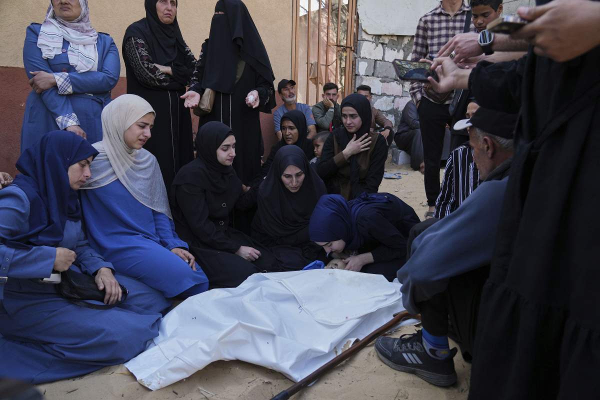 Palestinians mourn over the body of Kinan Edwan, 2 years old, killed in an Israeli army airstrike, during his funeral in Khan Younis, southern Gaza Strip, Saturday, April 19, 2025.