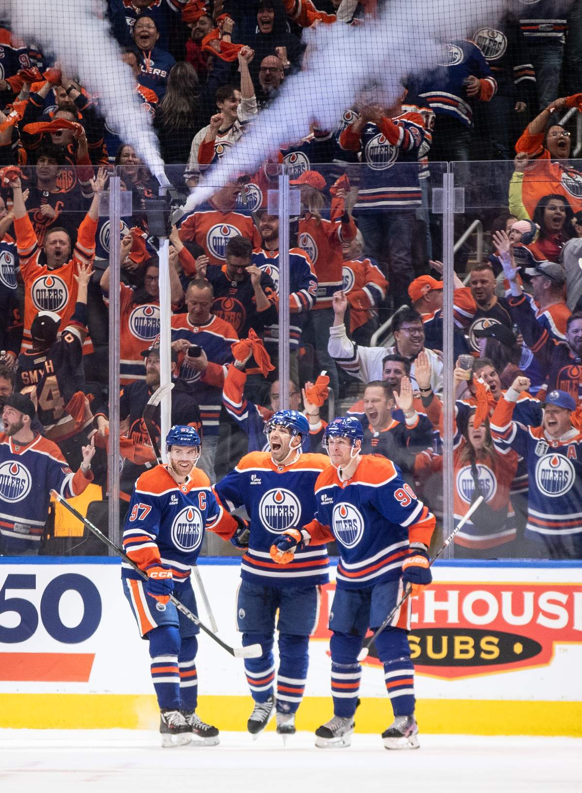 Edmonton Oilers' Connor McDavid (97), Evan Bouchard (2) and Corey Perry (90) celebrate a goal against the Los Angeles Kings during third period NHL playoff action in Edmonton on Friday, April 25, 2025.