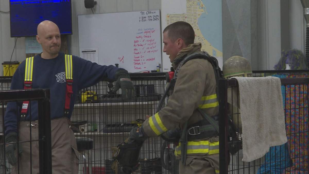 Firefighters talk to each other about training that was recently conducted.