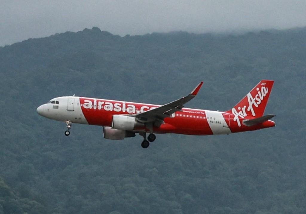 A file photo of an AirAsia aircraft flies over Chiang Mai, Thailand, on Wednesday, Aug. 7, 2024.