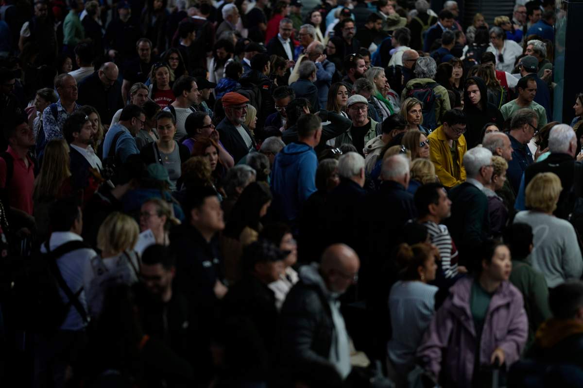 Passengers inside Atocha train station the day after a major power outage in Madrid, Tuesday, April 29, 2025.