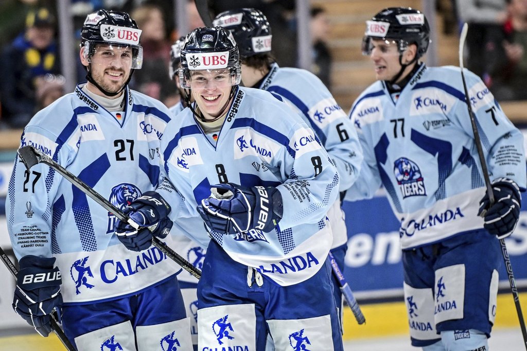 Straubing's Joshua Samanski, centre, celebrates with the team after scoring during the semifinal game between Team Canada and Germany's Straubing Tigers at the 96th Spengler Cup ice hockey tournament in Davos, Switzerland, Monday, Dec. 30, 2024.