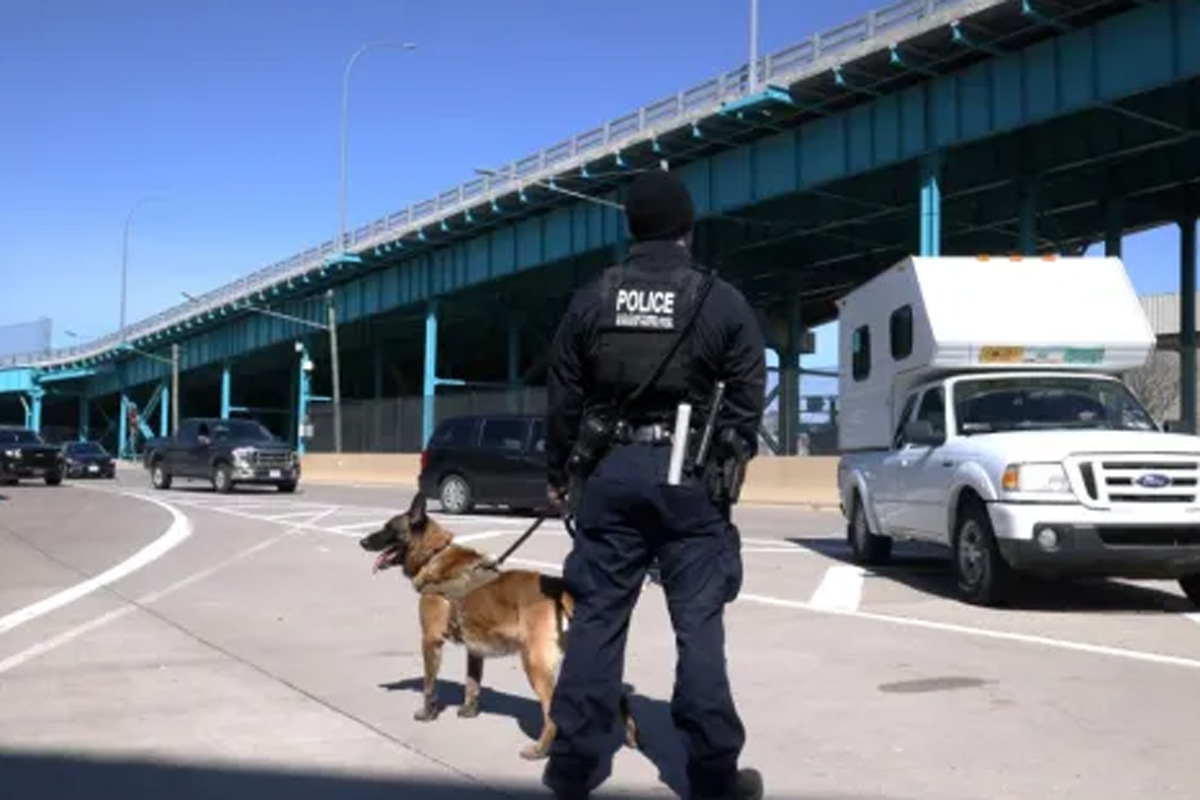A U.S. Customs and Border Protection officer and his K9 on enforcement duty at the Ambassador Bridge.