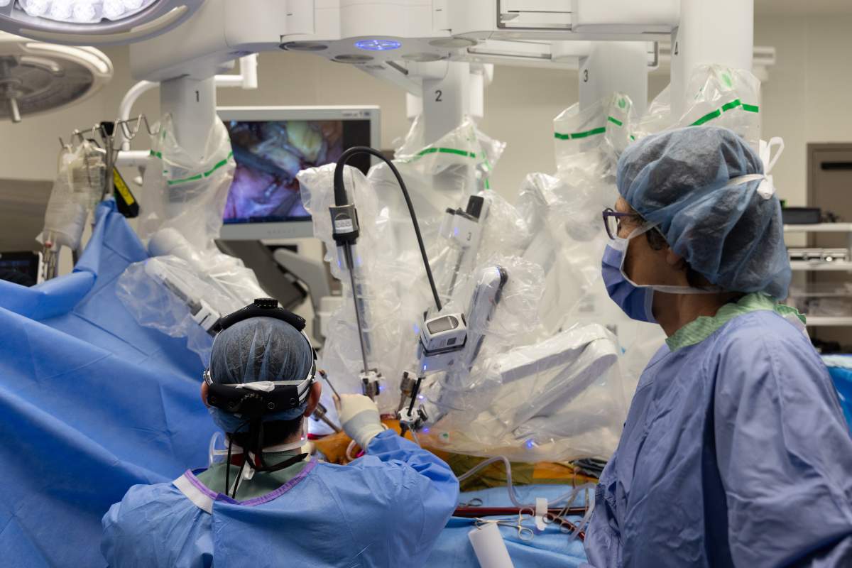 Da Vinci the robot assists the surgical team, including nurses and anesthesiologists, in performing a heart surgery.