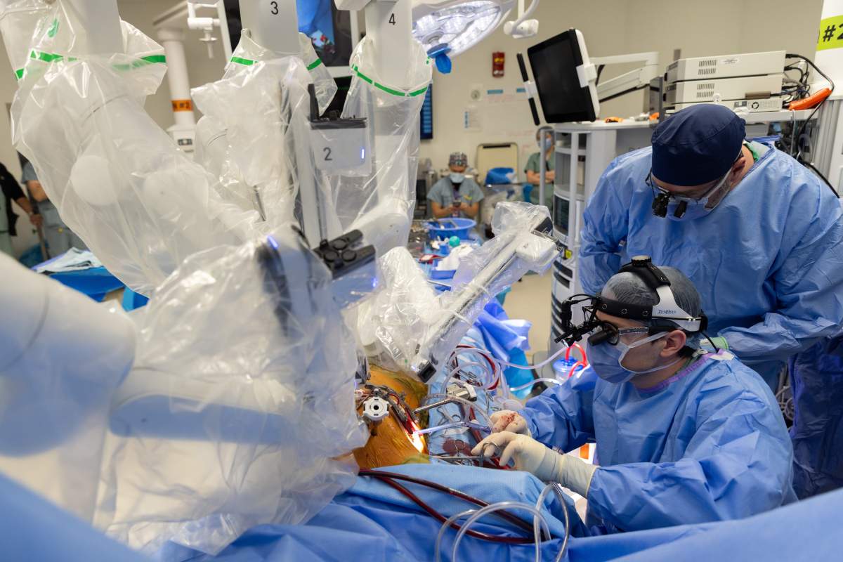 Da Vinci the robot assists the surgical team, including nurses and anesthesiologists, in performing a heart surgery.