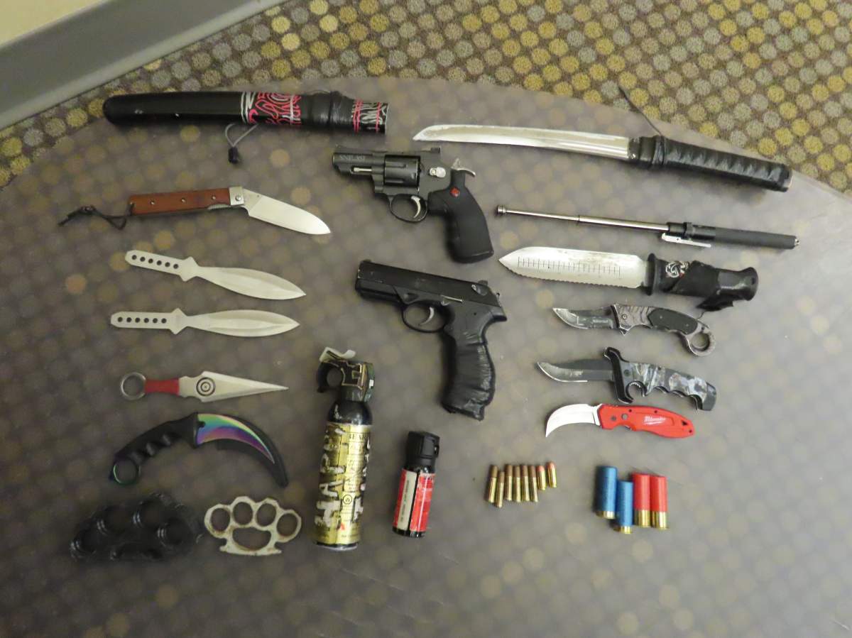 Calgary police show off the large variety of weapons seized when officers executed a search warrant on a home in Windsor Park last month.