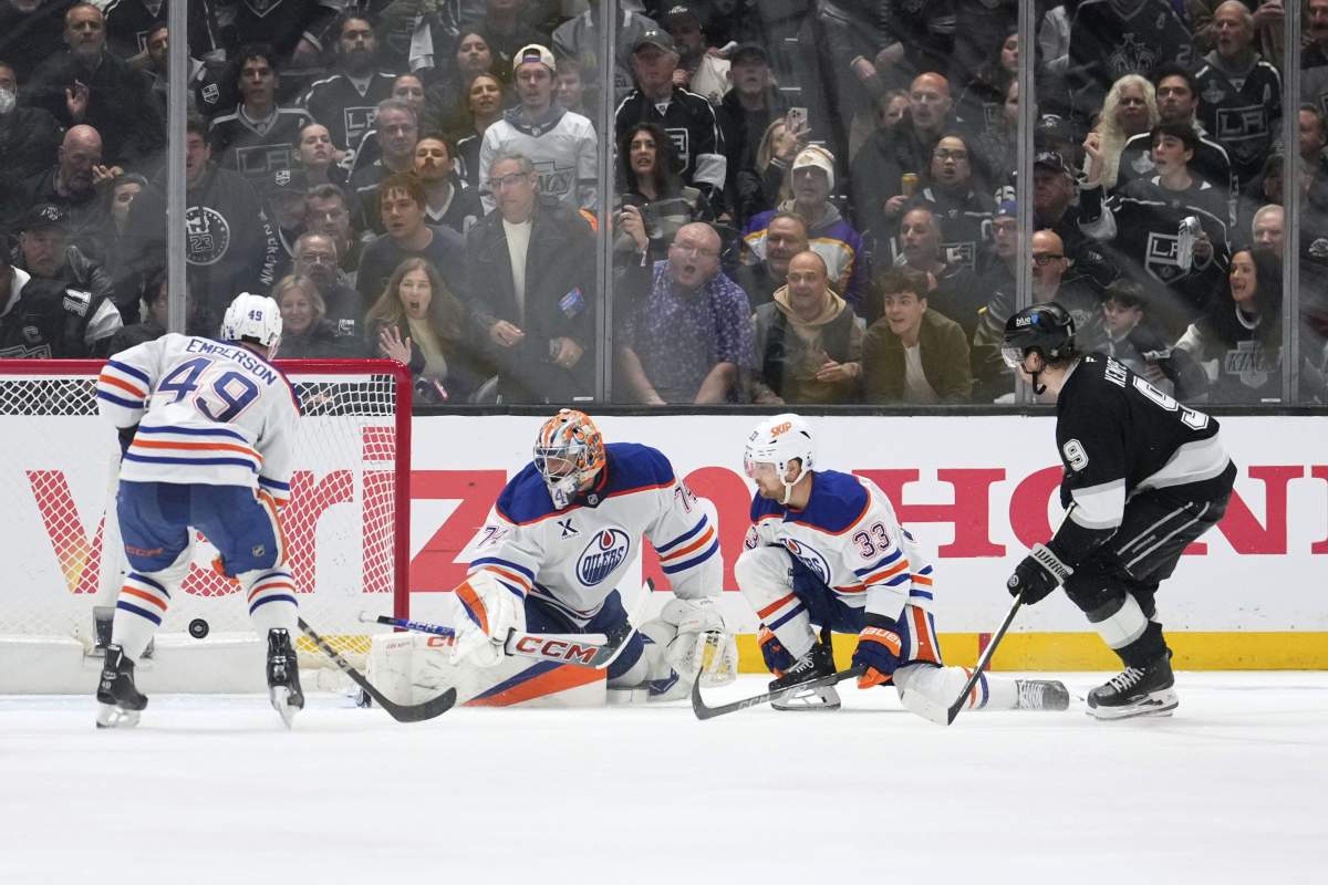 Los Angeles Kings right wing Adrian Kempe, right, scores on Edmonton Oilers goaltender Stuart Skinner, second from left, as defenceman Ty Emberson, left, and left wing Viktor Arvidsson watch during the third period in Game 2 of an NHL hockey first-round playoff series Wednesday, April 23, 2025, in Los Angeles.