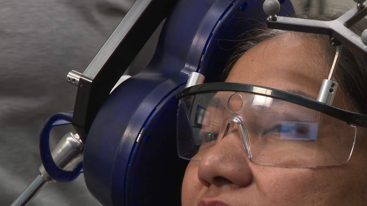 Transcranial magnetic stimulation (TMS) works by using electromagnetic pulses to increase activity on one side of the brain while decreasing it on the other.