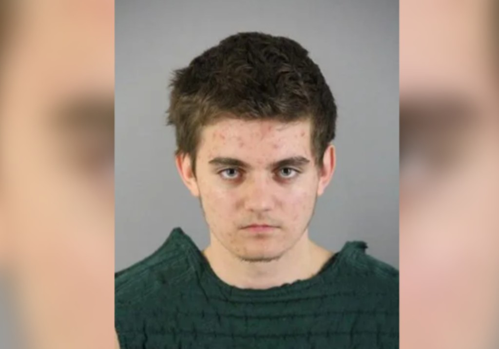 A mugshot of Nikita Casap, has been charged with murdering his mother and stepfather.