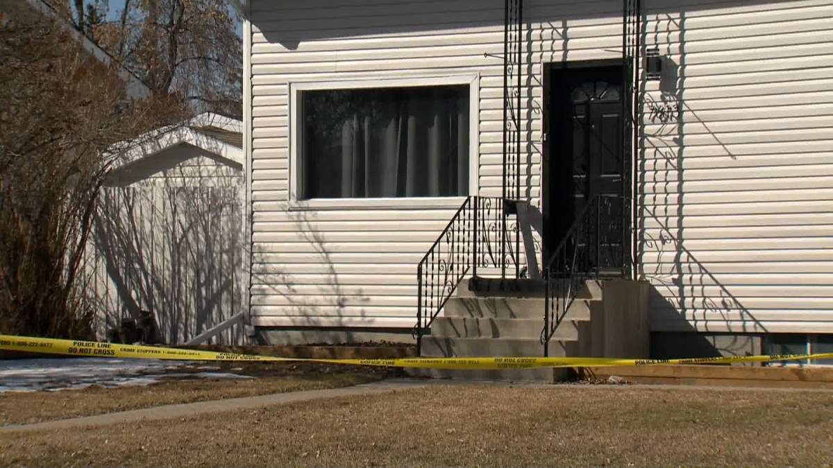 Police tape surrounds a house in the community of Ogden where Calgary police say a woman was found dead Friday evening after officers responded to reports of a disturbance.