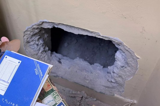 The burglars dug through a wall to gain access to the store.