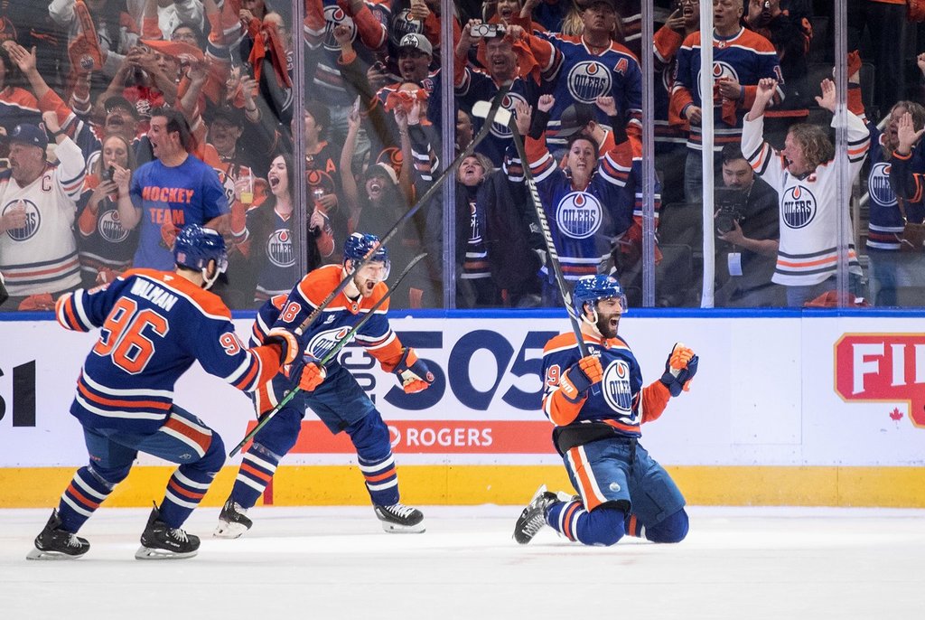 Edmonton Oilers' Adam Henrique (19), Jake Walman (96) and Zach Hyman (18) celebrate a goal against the Vegas Golden Knights during first period round 2, game 4 NHL Stanley Cup playoff action in Edmonton, Monday, May 12, 2025. 