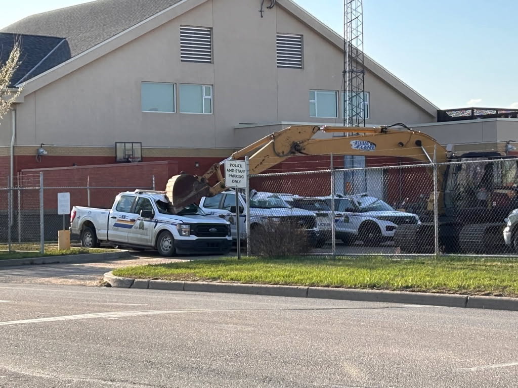 A stolen trackhoe (excavator) destroyed five cruisers at the Bonnyville RCMP detachment on Saturday, May 3, 2025.