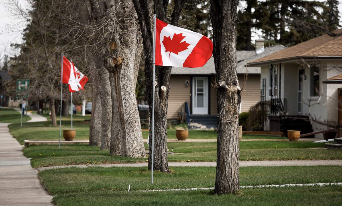 Canadian flags line a street in High River, Alta., Wednesday, May 7, 2025.