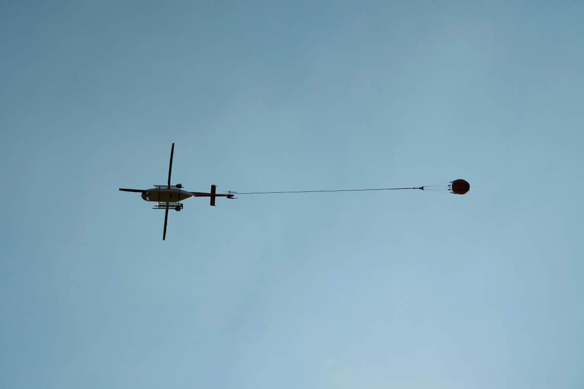 A helicopter drops water on an out of control wildfire in Manitoba as fire crews across the prairies face extreme fire conditions to start the week.