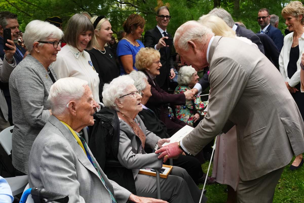 King Charles speaks with Betty Sinnett as he presents her a card for her 100th birthday in Ottawa during a royal visit on Monday, May 26, 2025. THE CANADIAN PRESS/Sean Kilpatrick