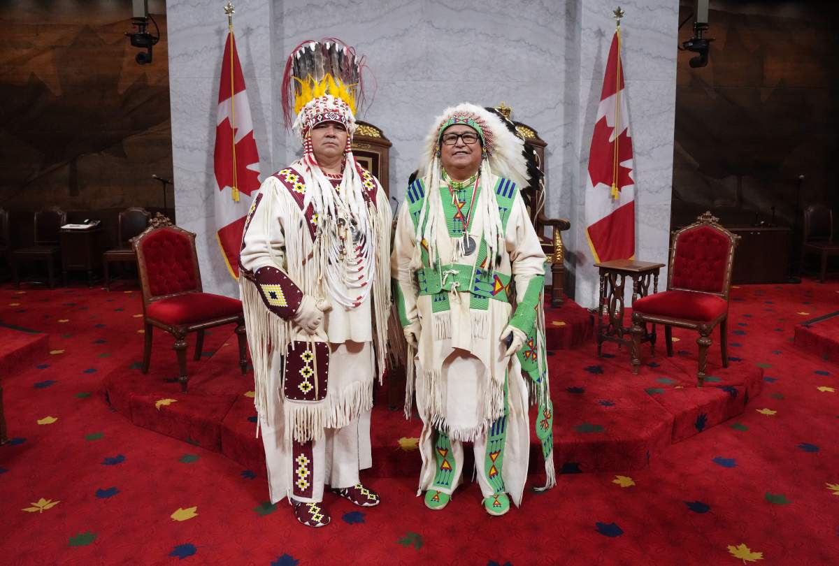 Siksika Nation Chief Ouray Crowfoot, left, and and Elder Leonard Weasel Traveller pose ahead of King Charles delivering the speech from the throne in the Senate in Ottawa on Tuesday, May 27, 2025. THE CANADIAN PRESS/Chris Young
