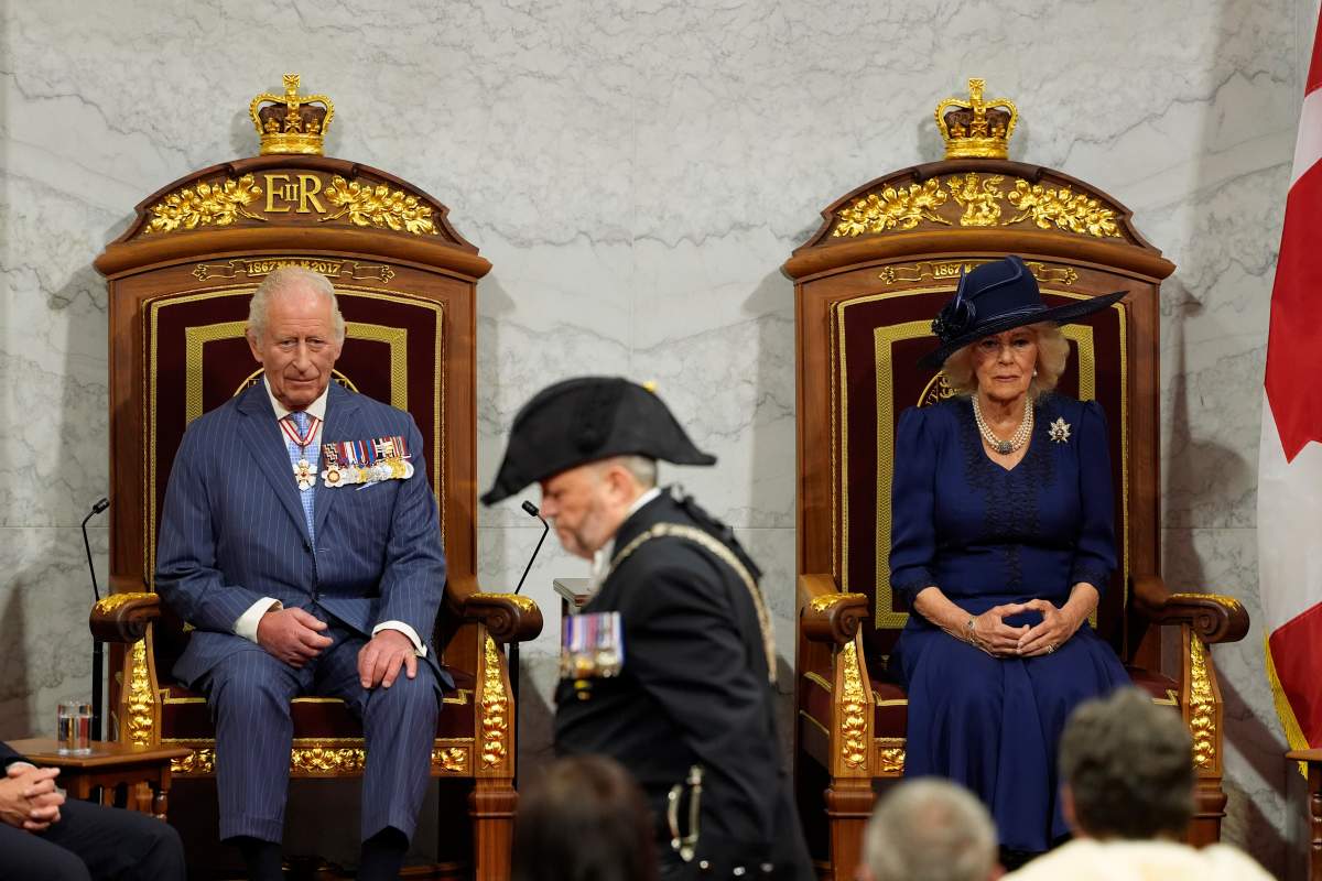 King Charles and Queen Camilla look on ahead of the King delivering the speech from the throne in the Senate in Ottawa on Tuesday, May 27, 2025. THE CANADIAN PRESS/Adrian Wyld