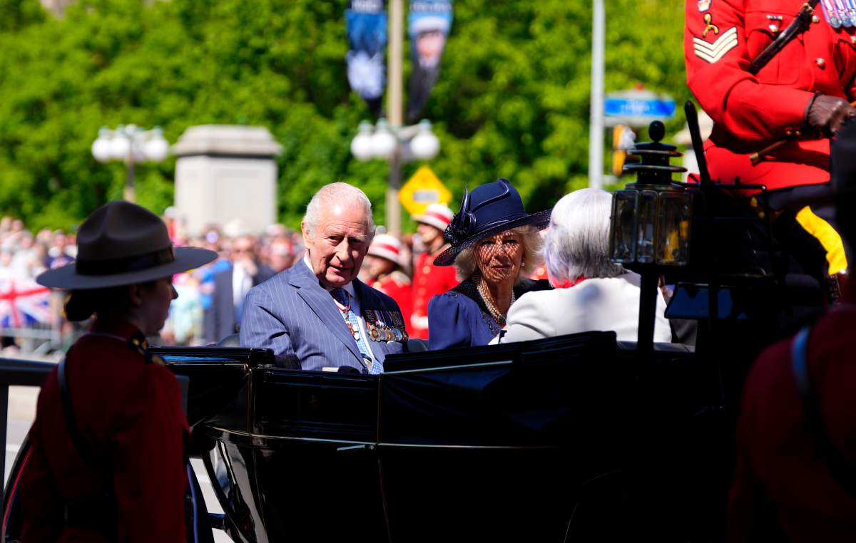 King Charles and Queen Camilla arrive by horse-drawn landau at the Senate of Canada building in Ottawa during a royal visit on Tuesday, May 27, 2025. THE CANADIAN PRESS/Justin Tang