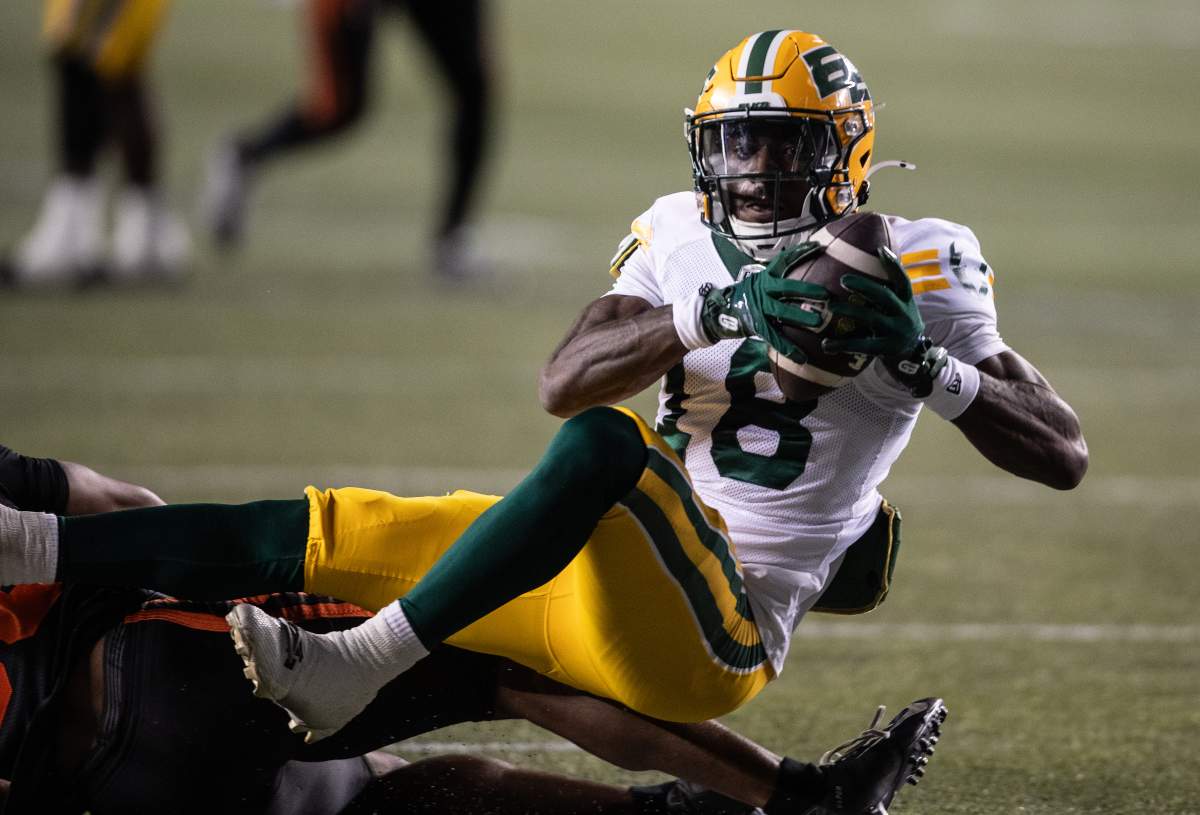 Edmonton Elks' Jalon Calhoun (18) scores a touchdown against the B.C. Lions during second half CFL pre-season action in Edmonton, on Friday May 30, 2025.