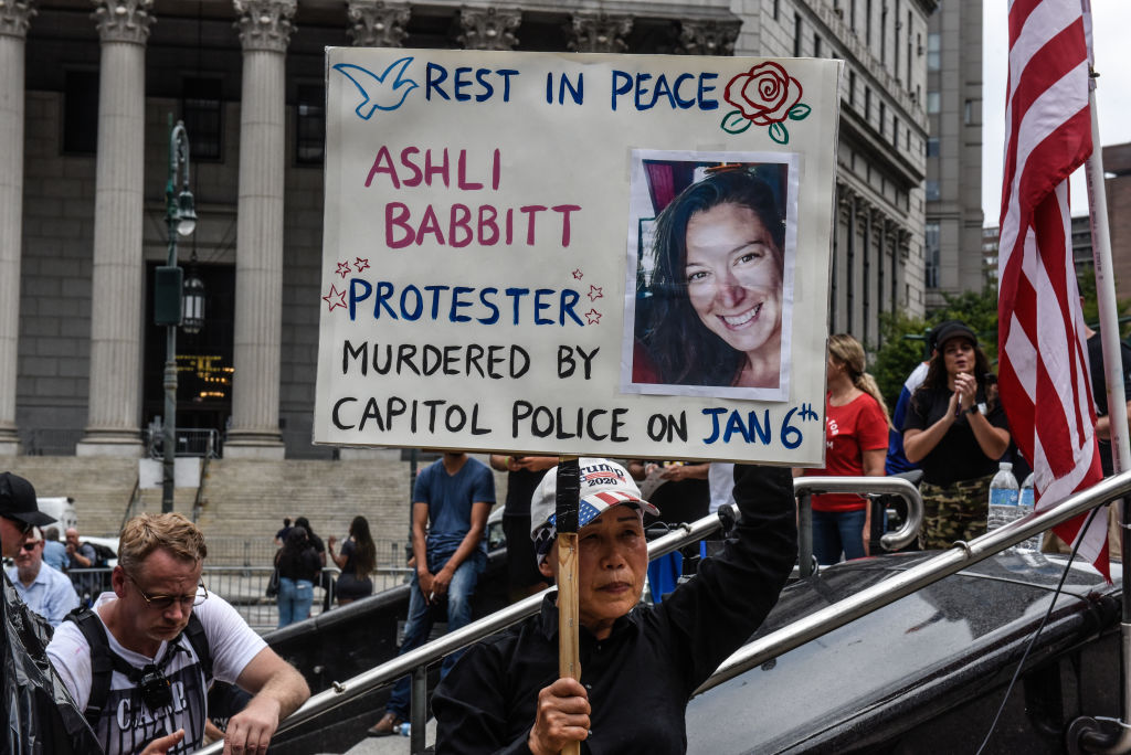 A right wing protester holds a sign about Ashli Babbitt while participating in a political rally on July 25, 2021 in New York City. Protesters were demanding a release of the people who were arrested on January 6th for their involvement in the breach of the Capitol building.