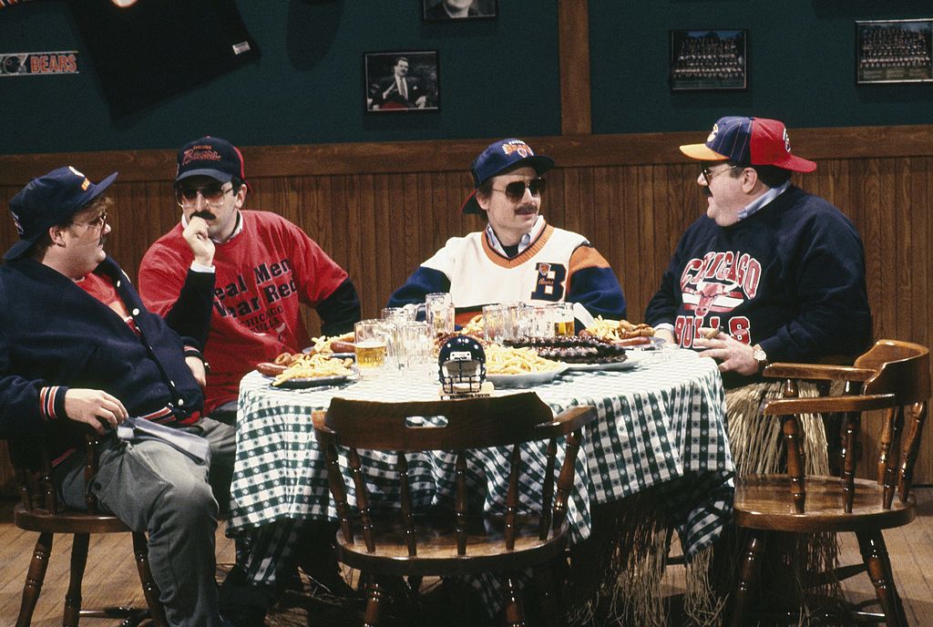 Pictured: (L-R) Chris Farley as Todd O'Connor, Robert Smigel as Carl Wollarski, Mike Myers as Pat Arnold, George Wendt as Bob Swerski during "Bill Swerski's Super Fans" skit on SNL in 1991.
