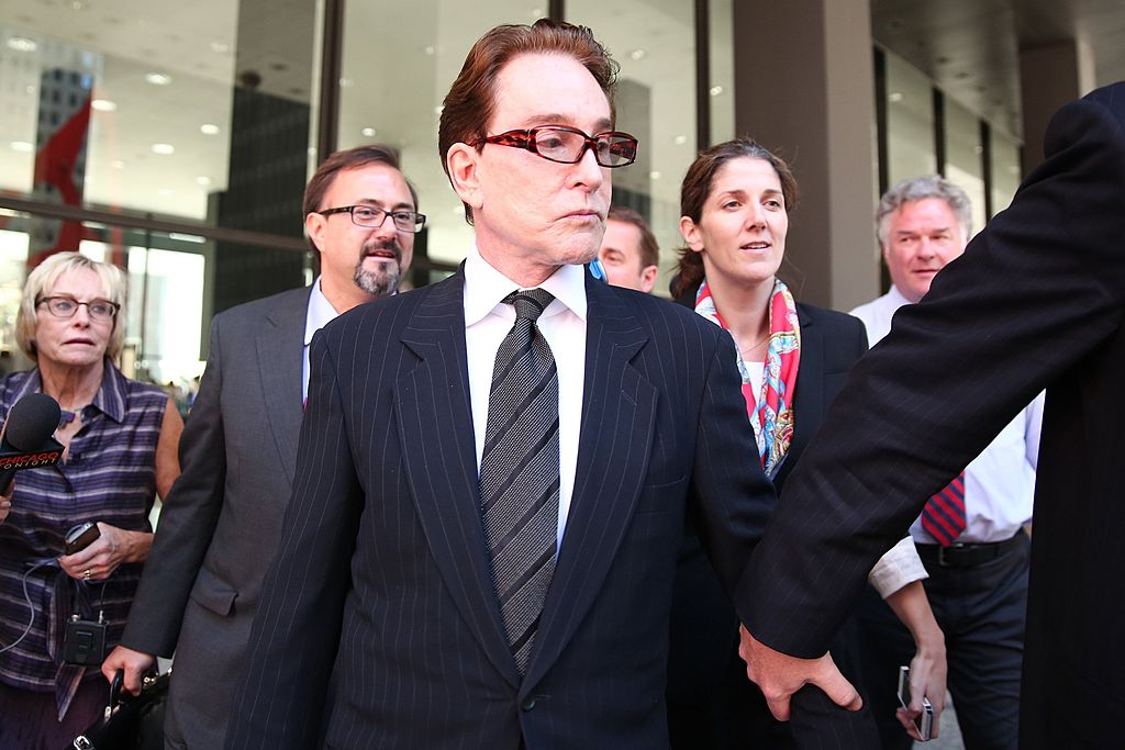 Beanie Babies founder Ty Warner is escorted from the Dirksen U.S. Courthouse in Chicago, Illinois, on Wednesday, October 2, 2013.