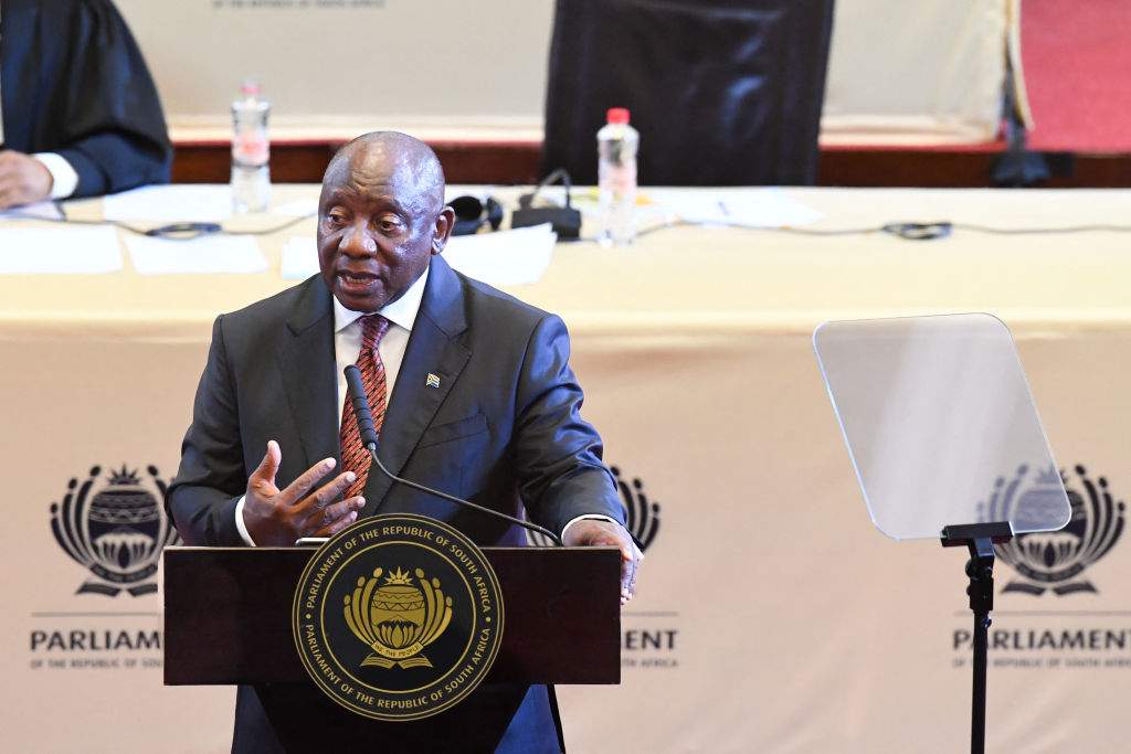 South African President Cyril Ramaphosa gestures as he delivers the State of the Nation address at the Cape Town City Hall on February 6, 2025
