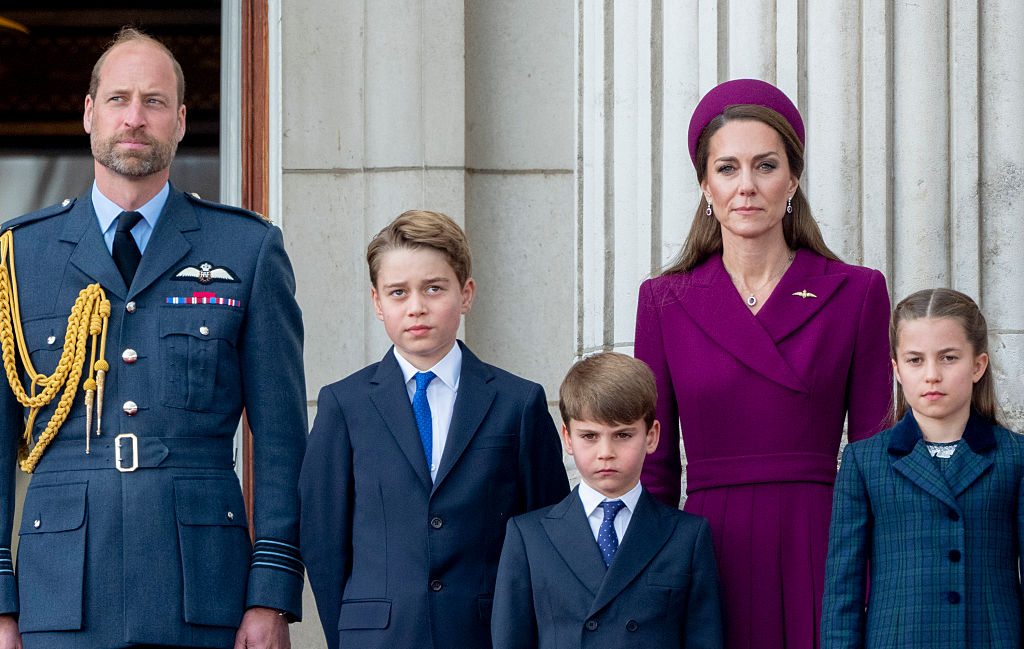 Prince William, Prince of Wales and Catherine, Princess of Wales with Princess Charlotte of Wales, Prince George of Wales and Prince Louis of Wales watch a flypast from the balcony of Buckingham Palace after the military procession to mark the 80th anniversary of VE Day on May 5, 2025 in London, England.