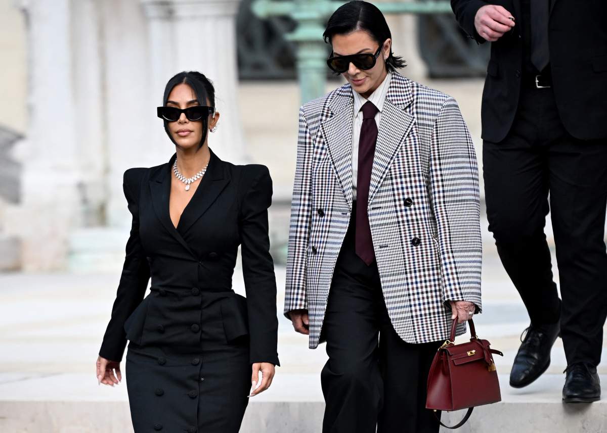 US celebrity Kim Kardashian (L) leaves with her mother Kris Jenner (R) the Assize Court after testifying in a trial over the 2016 robbery that saw her relieved of millions of dollars' worth of jewelry at gunpoint in Paris, on May 13, 2025.