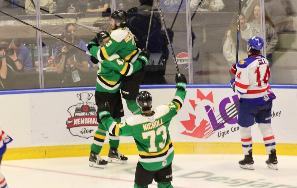 London Knights defenceman Sam Dickinson jumps into the arms of London forward Blake Montgomery after Montgomery's go-ahead goal in the third period of the Knights 5-2 win over Moncton in the semi-final of the 2025 Memorial Cup tournament.