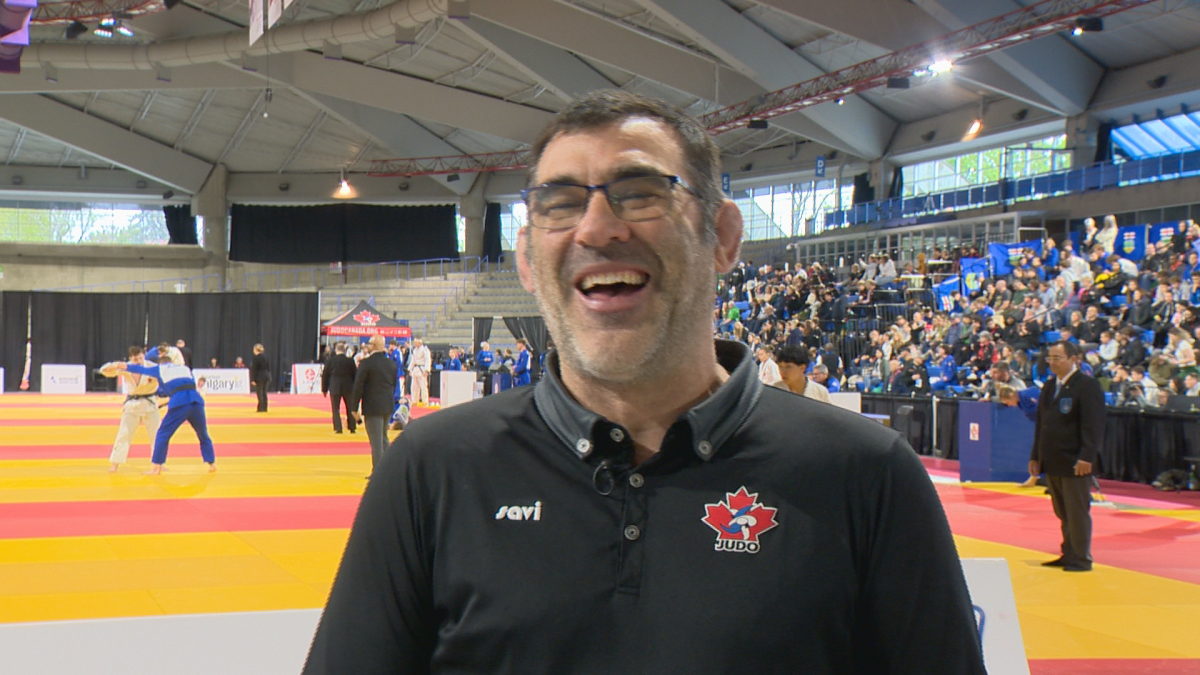 Nicolas Gill laughs while being interviewed