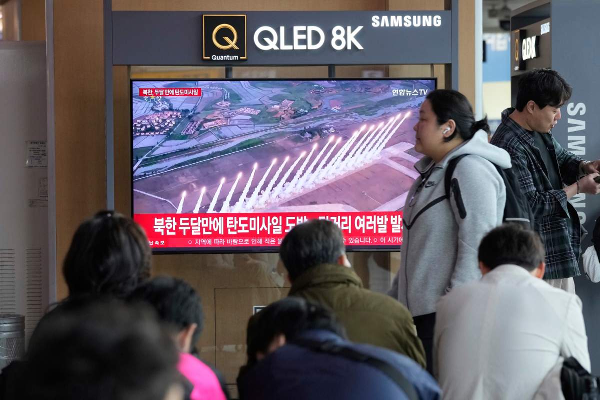 A TV screen shows a file image of North Korea's missiles launch during a news program at Seoul Railway Station in Seoul, South Korea, Thursday, May 8, 2025.