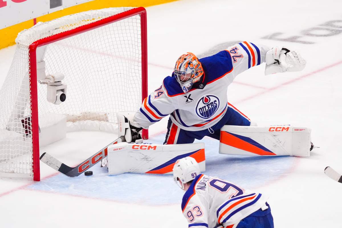 Edmonton Oilers goaltender Stuart Skinner makes a save against the Dallas Stars during the third period in Game 2 of the Western Conference finals in the NHL hockey Stanley Cup playoffs, Friday, May 23, 2025, in Dallas.