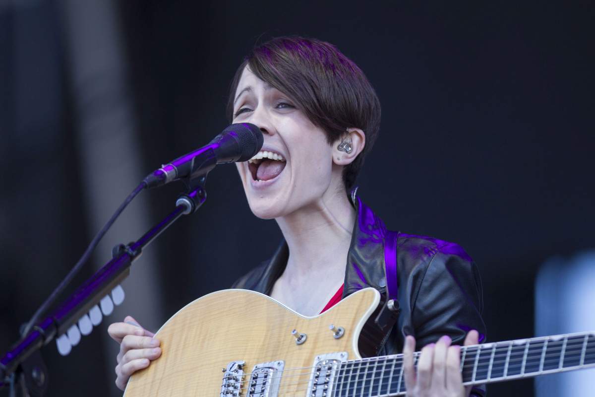 Sara Quin performs at the Lollapalooza Festival in Chicago, Sunday, Aug. 4, 2013.