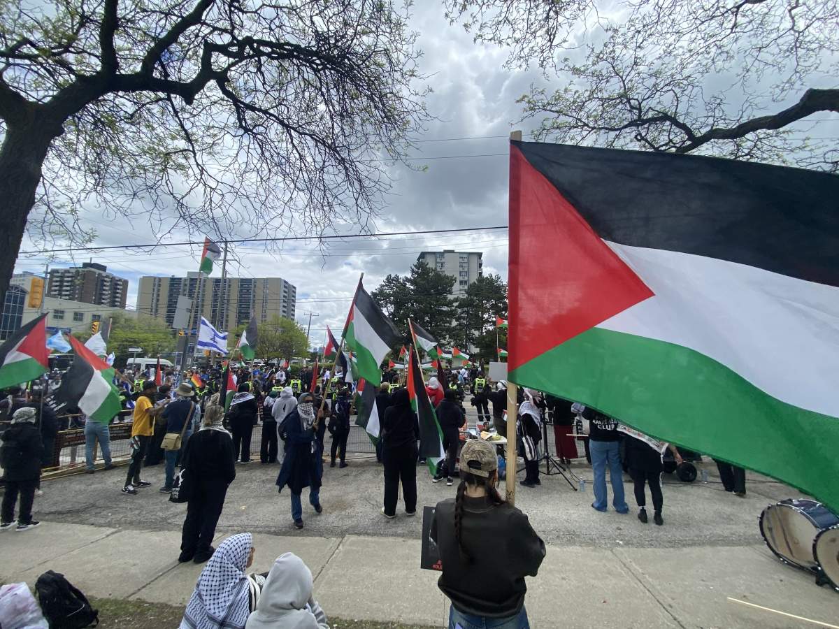 Pro-Palestinian protesters are seen at the annual Walk with Israel event in Toronto on May 25, 2025.