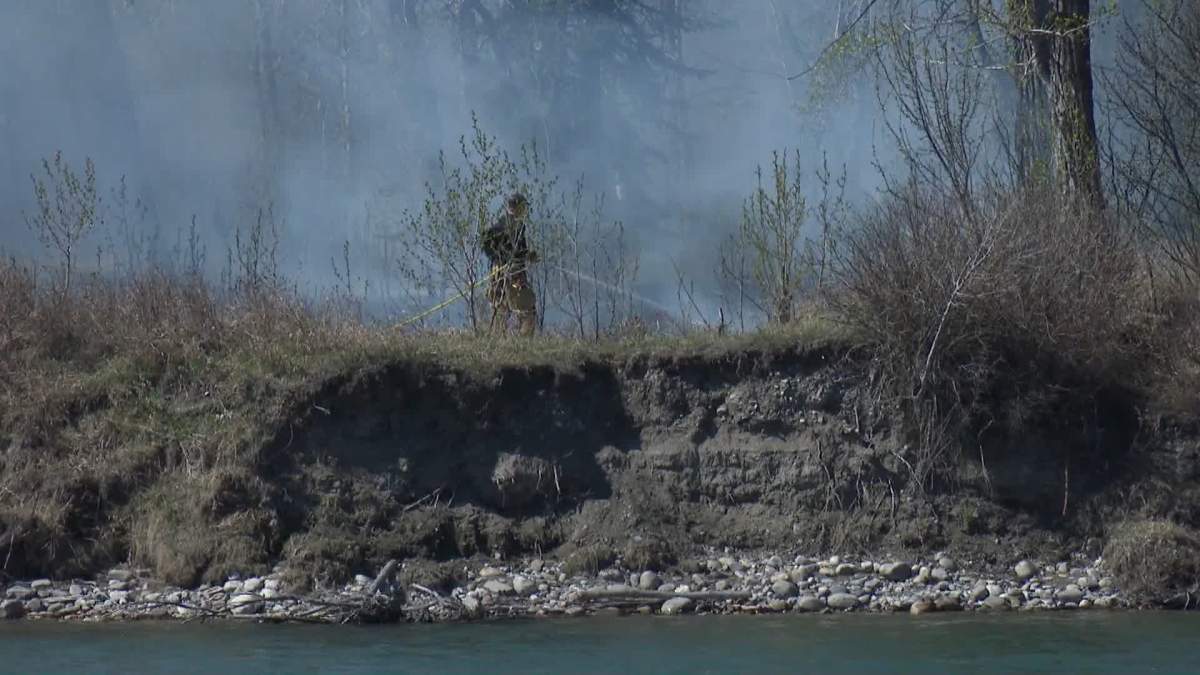 The fire broke out in an area of heavy brush north of the Shaganappi Point golf course and near the CPKC railway tracks.