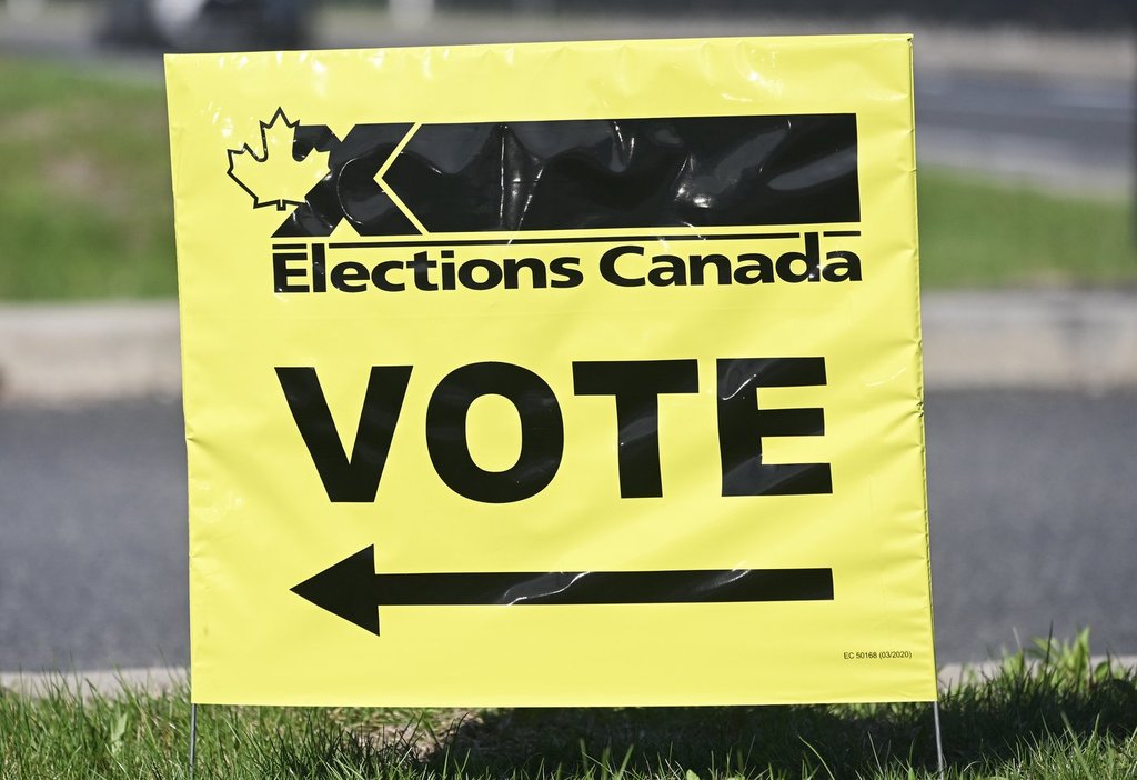 An Elections Canada sign points the way to a polling station on federal election day in Chambly, Que., Monday, April 28, 2025. 