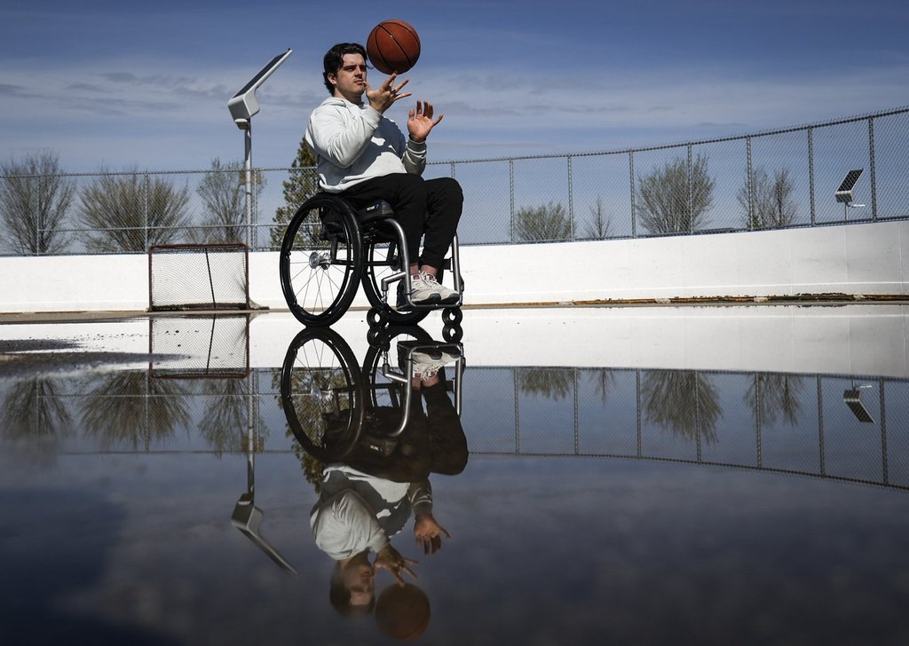 Humboldt Broncos bus crash survivor Ryan Straschnitzki tosses a basketball in Airdrie, Alta., on May 14, 2025.