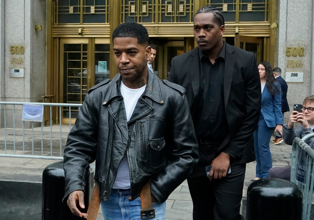 Rapper Kid Cudi (L) leaves the federal court after appearing at the Sean 'Diddy' Combs sex trafficking trial in New York City on May 22, 2025.