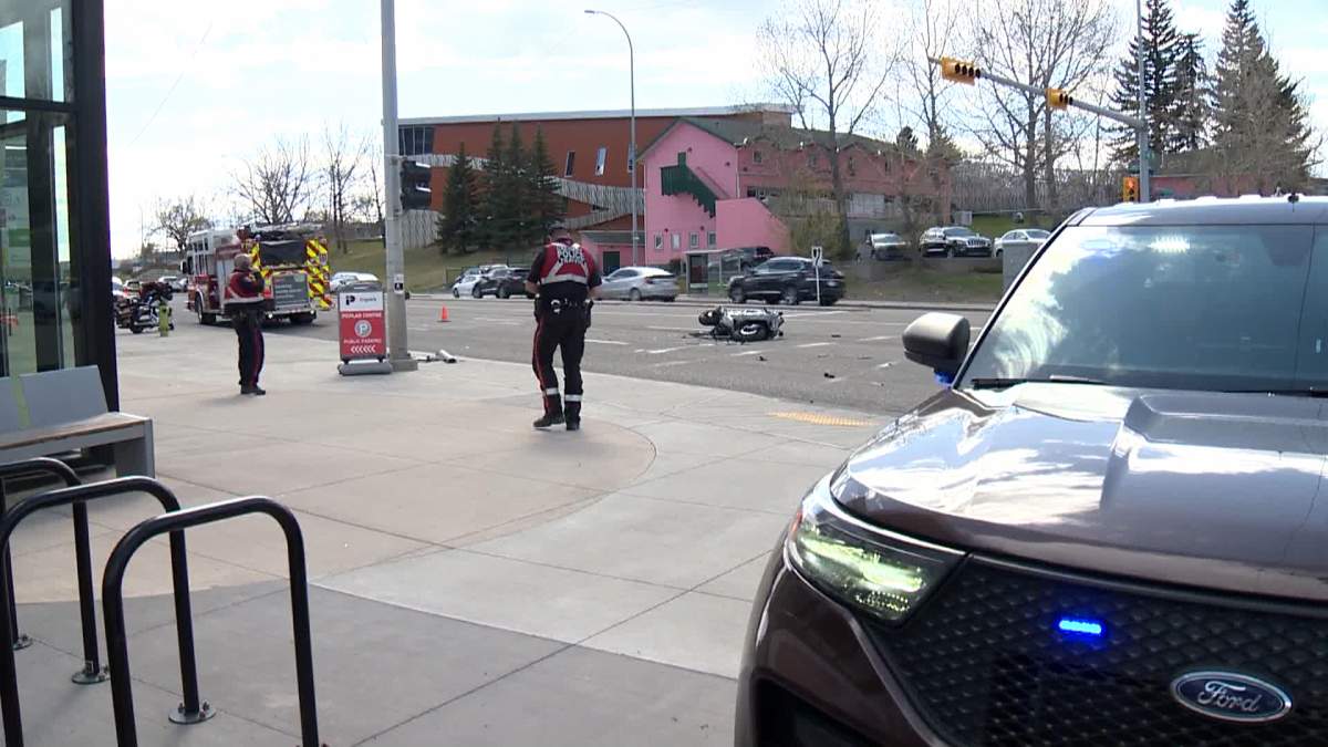 The crash, involving a motorcycle that police said was rear-ended by a stolen vehicle, shut down Macleod Trail near 53 Avenue S.W. for about two hours on Wednesday afternoon.