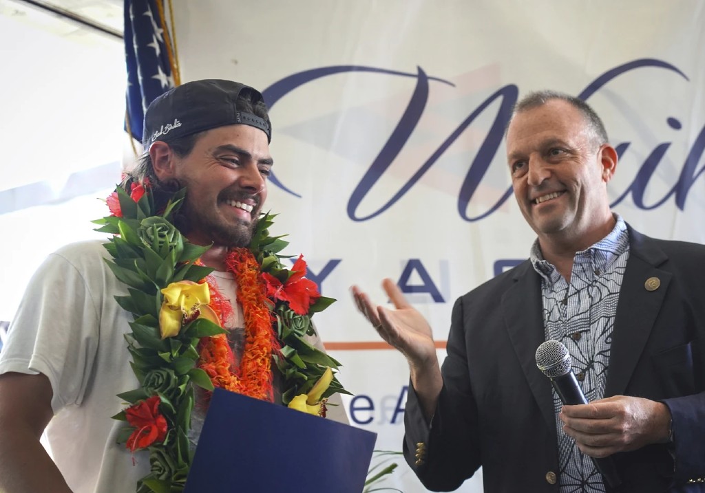 Governor Josh Green presents a proclamation to Oliver Widger, 29-year-old Oregon man who sailed from Oregon to Hawai’i, on Saturday, May 24, 2025 in Waikiki, Hawaii.