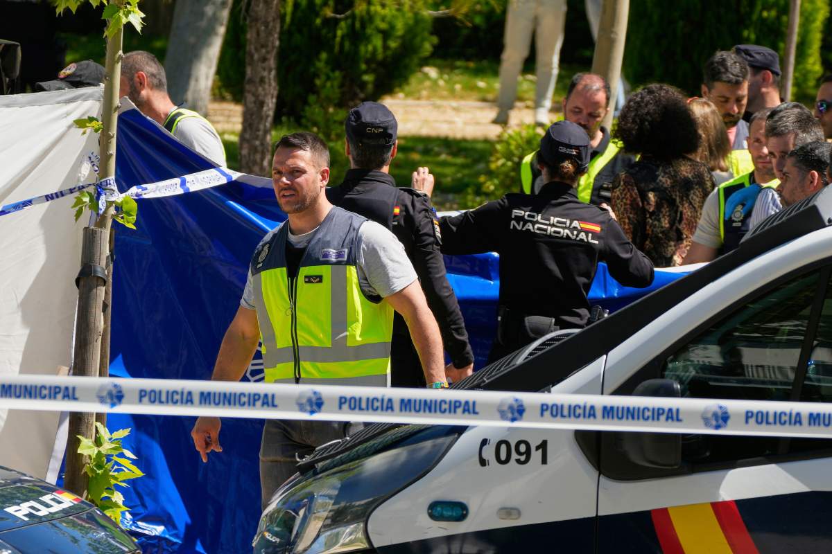 Members of the judicial police at the scene after an adviser to former Ukrainian president Viktor Yanukovych was shot, outside a school in Madrid, Spain, Wednesday, May 21, 2025. 