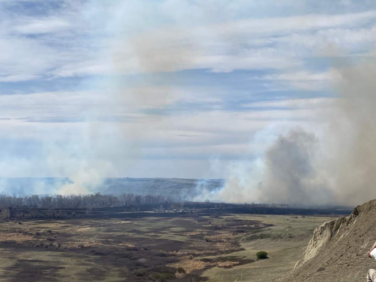 A fire burning in heavy brush on the Siksika First Nation, south of Cluny, has forced a number of nearby resident from their homes.