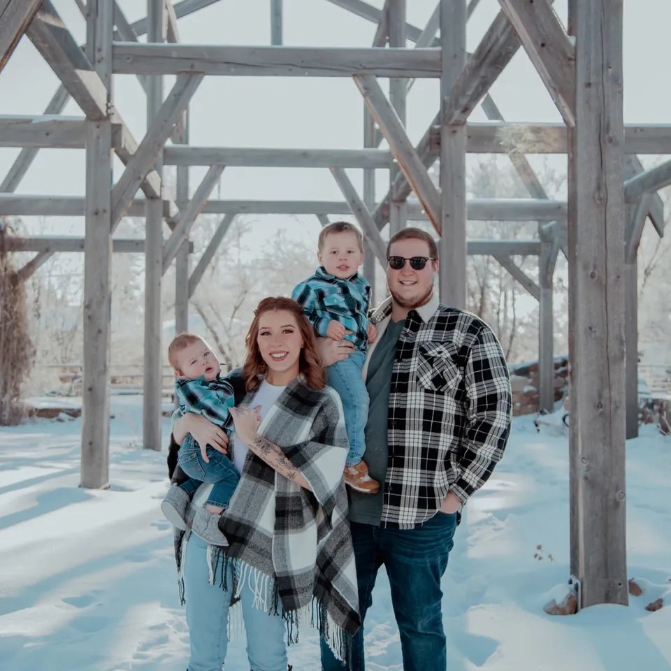 An undated family portrait of Brandon Lethbridge with his wife and two sons, taken in Leduc, Alta.