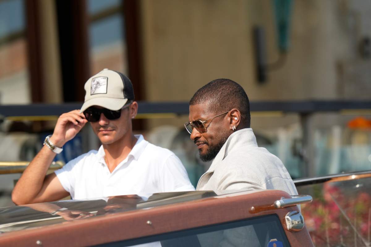 Singer Usher Raymond, right, arrives at the Gritti hotel in Venice, Italy, on Thursday, June 26, 2025, ahead of the festivities.