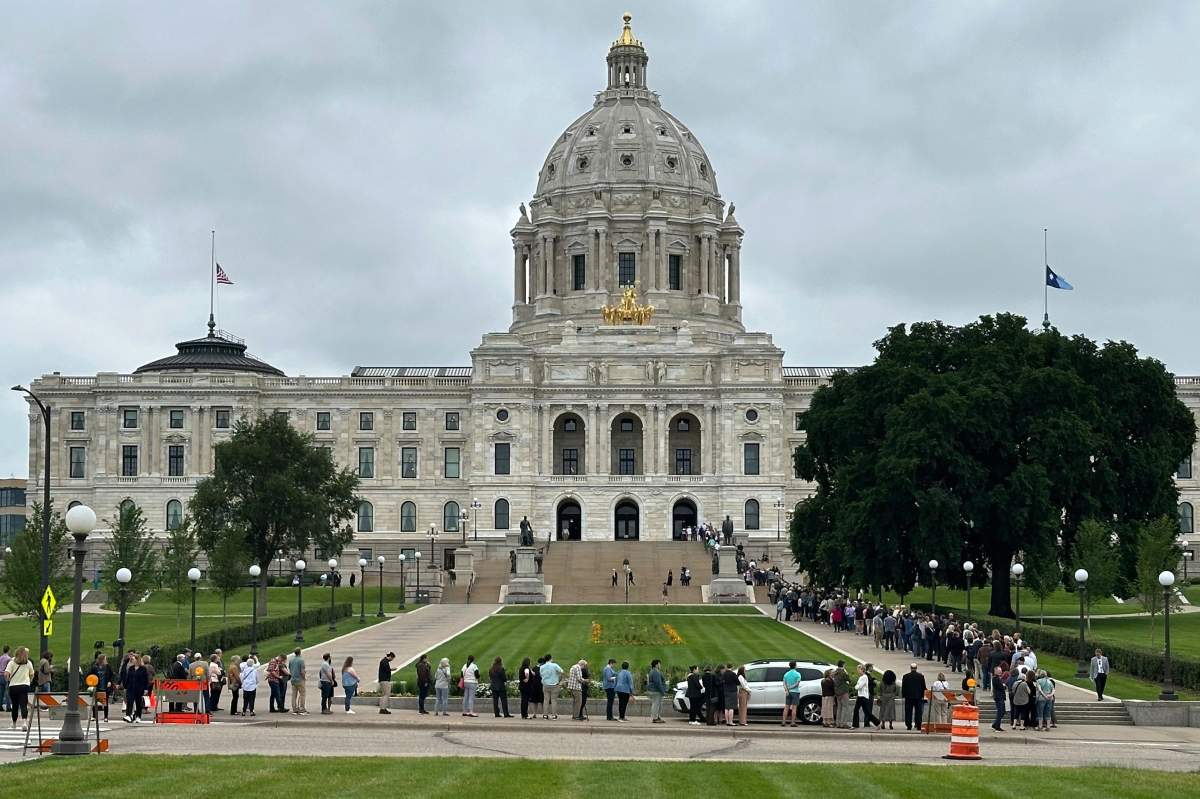 People wait on line to pay their respects to former Minnesota House Speaker Melissa Hortman, who will lie in state with her husband, Mark, and their golden retriever, Gilbert at the Minnesota Capitol rotunda on Friday, June 17, 2025 in St. Paul, Minn. (AP Photo/Mark Vancleave)