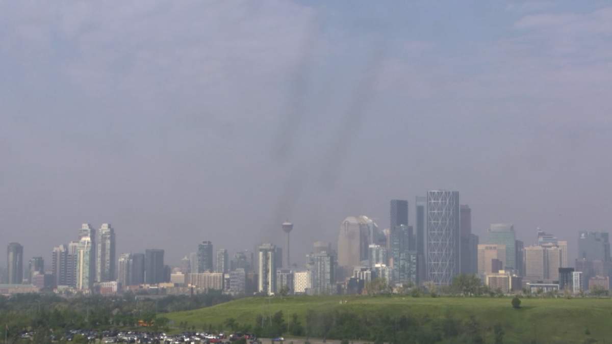 Smoke from wildfires can be seen in Calgary on June 10, 2025.