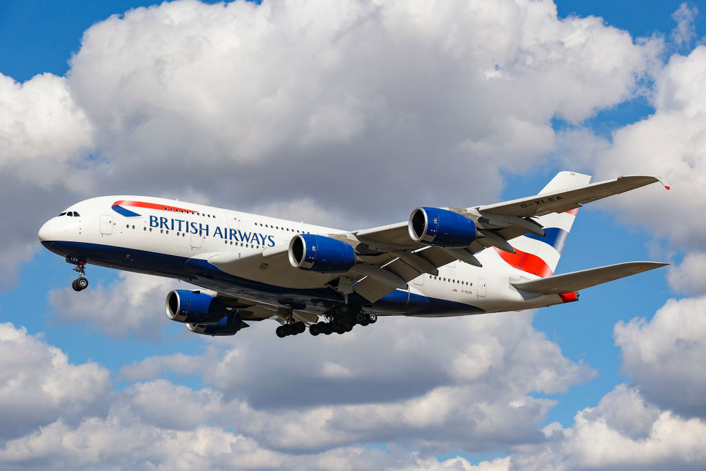 British Airways Airbus A380 airplane as seen on final approach flying over the houses in Myrtle Avenue, arriving for landing in London Heathrow Airport.