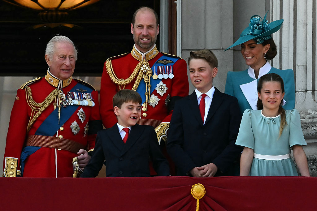 Britain's King Charles III, Britain's Prince William, Prince of Wales, Britain's Prince Louis of Wales, Britain's Prince George of Wales, Britain's Catherine, Princess of Wales and Britain's Princess Charlotte of Wales, smile whilst standing on the balcony of Buckingham Palace after attending the King's Birthday Parade "Trooping the Colour" in London on June 14, 2025.
